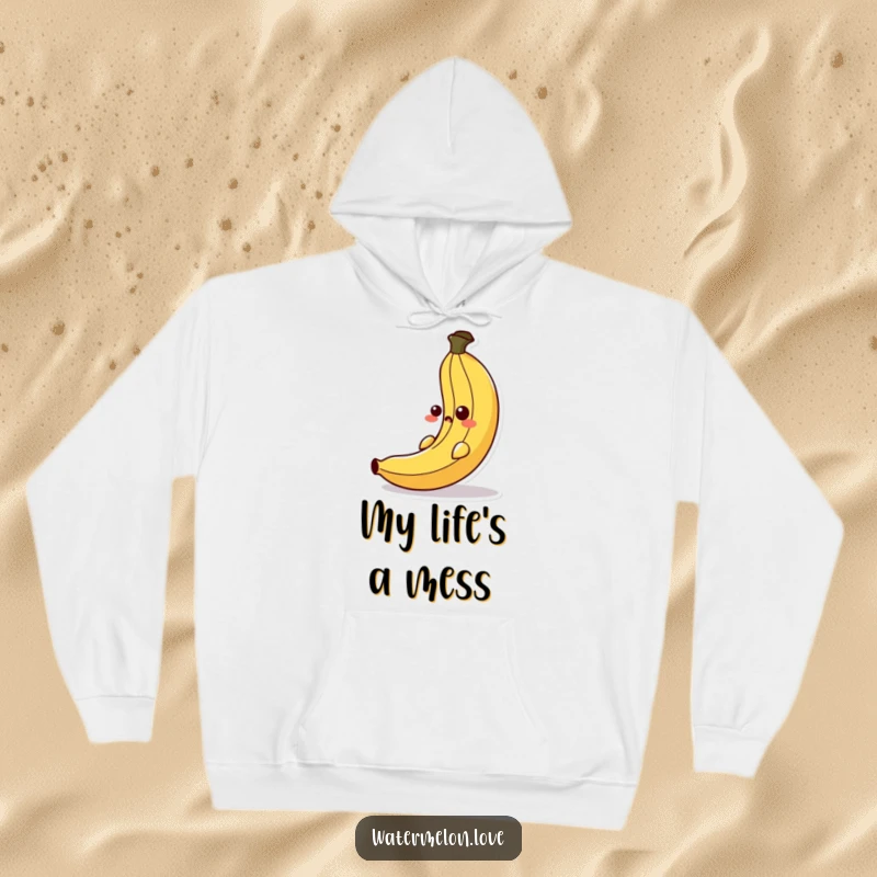 Funny hoodie depicting an anthropomorphic banana peel executing a surprise slip with a cartoonishly shocked face, great for cozy humor.