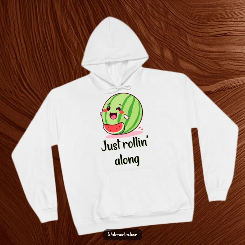 Stylized, happy watermelon hoodie captured in a delightful downhill roll, conveying a sense of exhilarating freedom and pure happiness.
